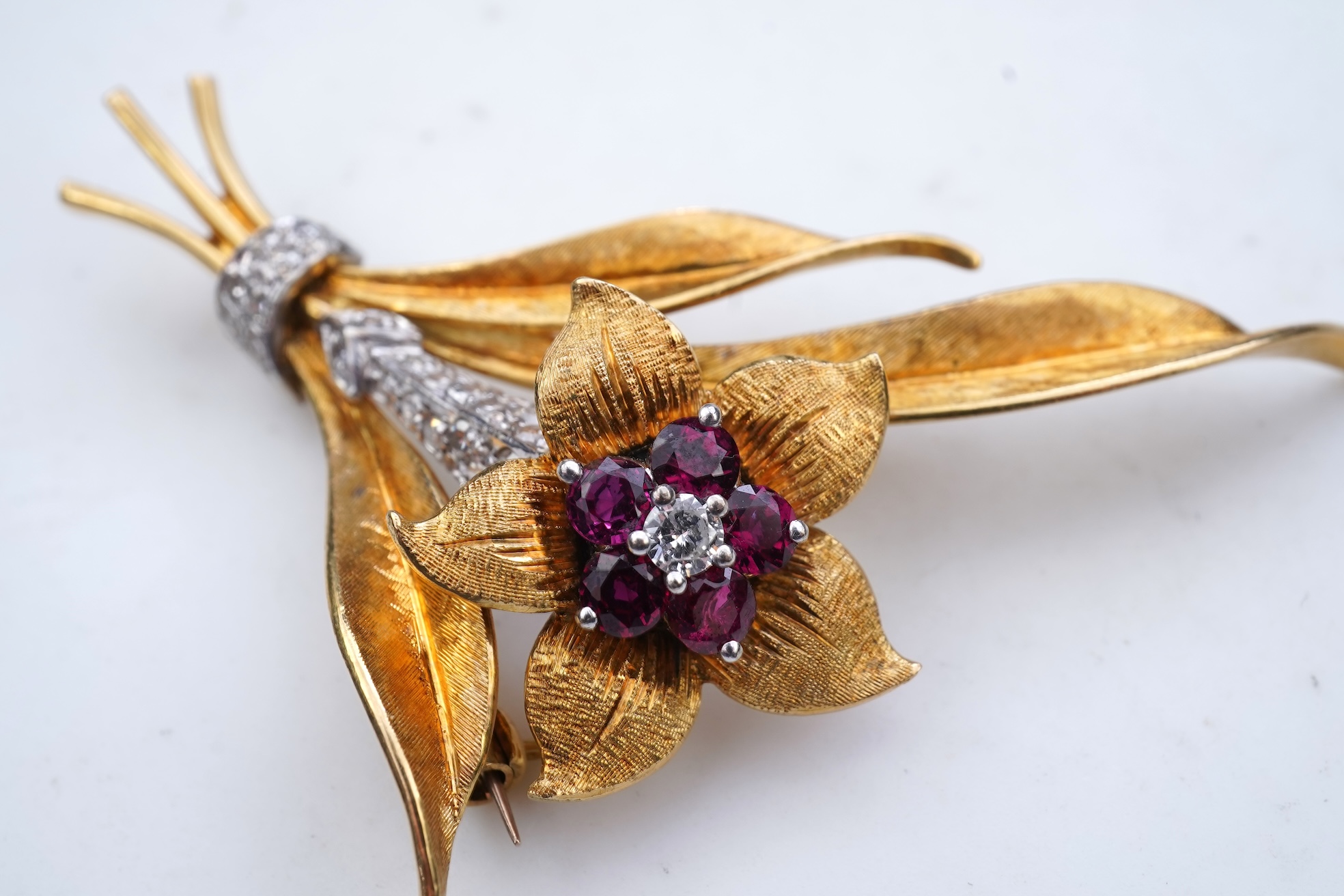 A gold, ruby and diamond brooch, circa 1966